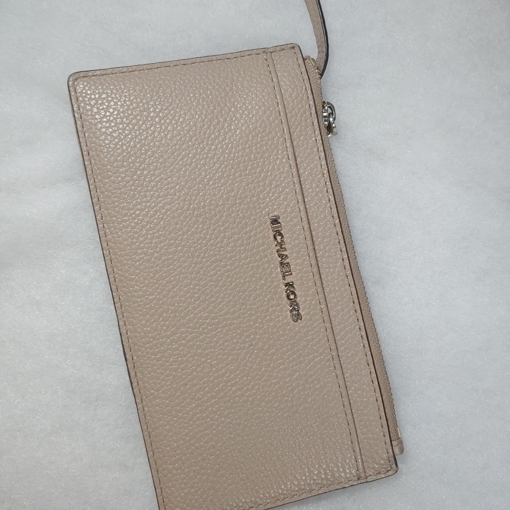 Gently used MK wallet sold individually